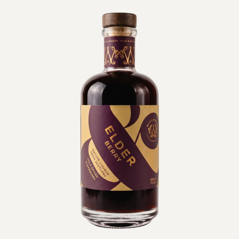 A bottle of Elder Berry liqueur with a dark purple and gold label, set against a clean light grey background.