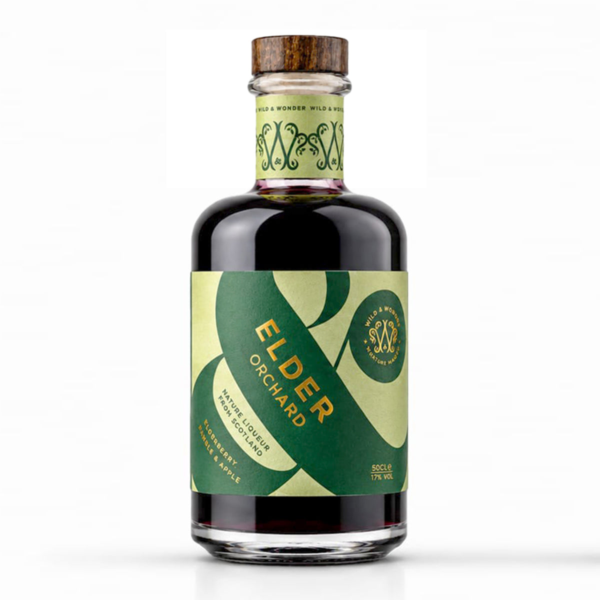A 500ml bottle of Wild & Wonder Elder Orchard elderberry, bramble & apple liqueur with a green and light green label and wooden stopper, on a white background.