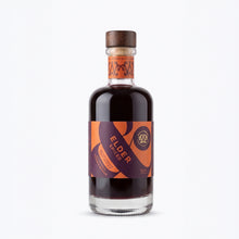 A 200ml bottle of Wild & Wonder Elder Spiced elderberry, ginger & orange liqueur with a dark amber liquid, dark purple and orange label and wooden stopper.