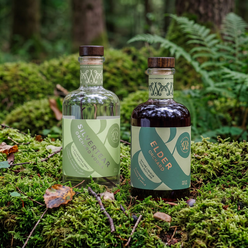 Wild & Wonder Orchard Bundle: a bottle of Silvertear Orchard apple & bay leaf vodka and a bottle of Elder Orchard elderberry, bramble & apple liqueur.