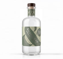 A bottle of Silvertear Orchard Vodka on a solid white background. The clear glass bottle features a dark brown wooden stopper and a label with olive green and light green graphics.