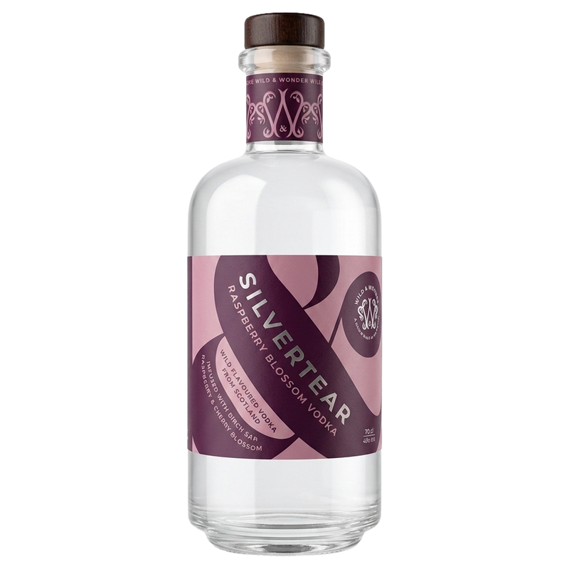 A bottle of Silvertear Raspberry Blossom Vodka on a plain white background. The clear glass bottle features a dark brown wooden cap and a pink and purple label with white text.