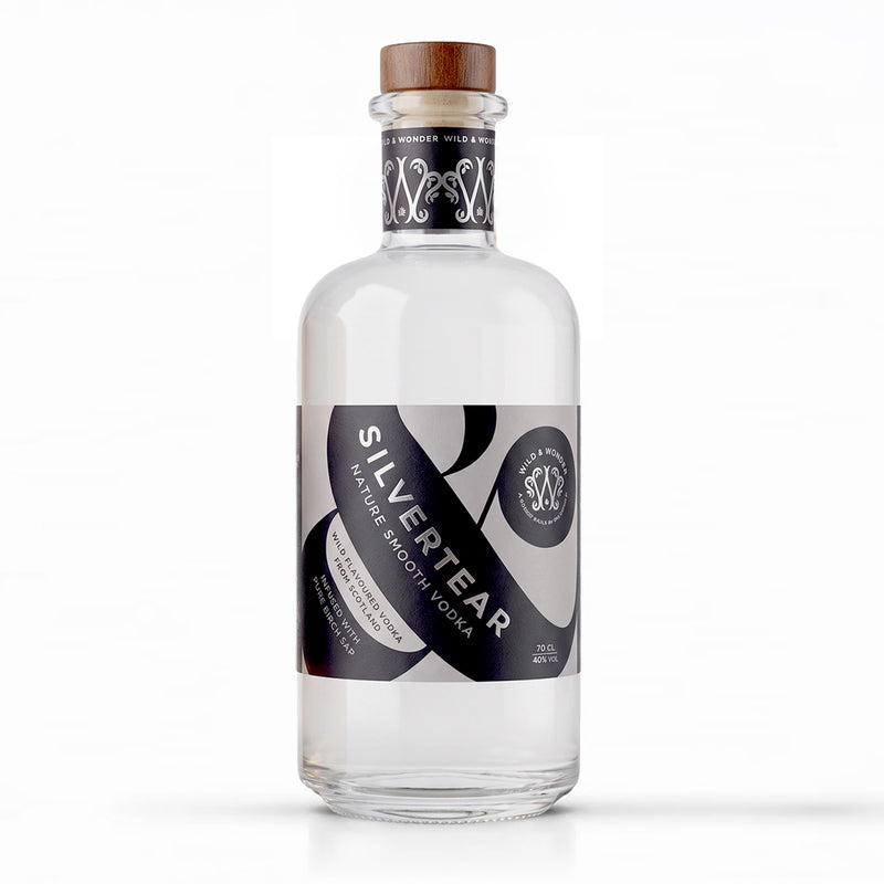A bottle of Silvertear Vodka on a solid white background. The clear glass bottle features a black and white label with silver accents and a brown wooden cap.