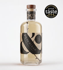 A bottle of Silver Tear Vintage Birch Vodka on a clean white background, featuring a black and beige label with a brown wooden cap. A 'great taste 2026' award badge is displayed in the top right corner.