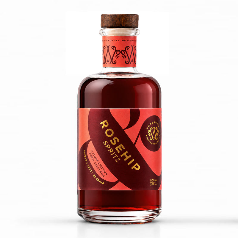 Bottle of Wild & Wonder Rosehip Spritz liqueur with botanical ingredients. Rosehip and rum flavour